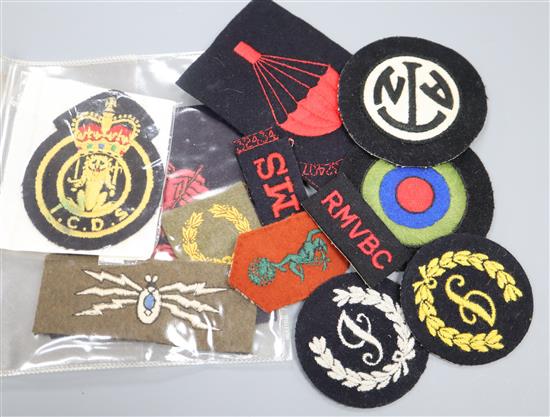 A collection of World War II and later embroidered badges